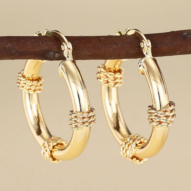Geometric copper clip-on earrings with ring and line design elements