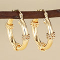 Geometric copper clip-on earrings with ring and line design elements