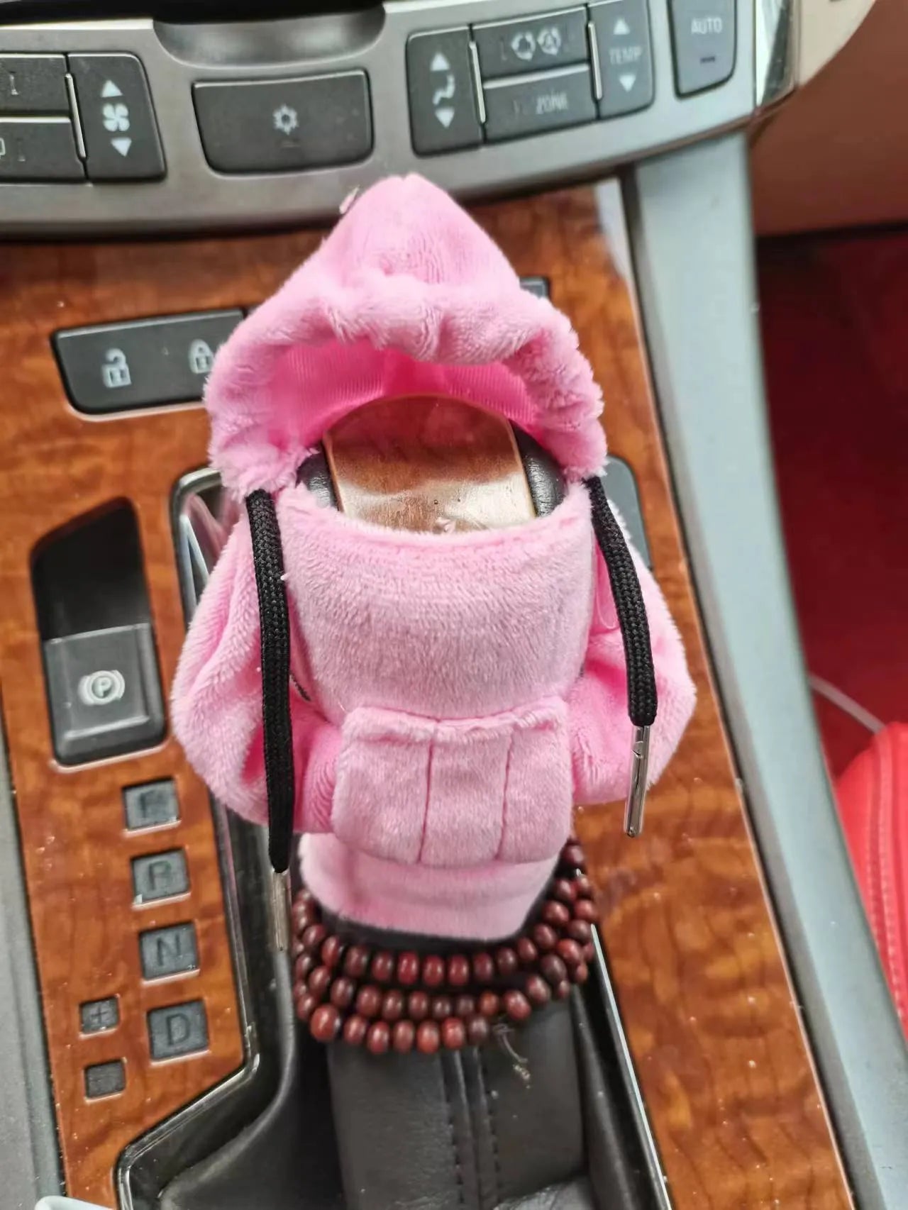 Dutch velvet car gear handle sleeve cover shown in various colours including black, red, blue, and pink.