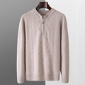 Men's grey wool half zip sweater with a diamond lattice pattern, shown on a model.