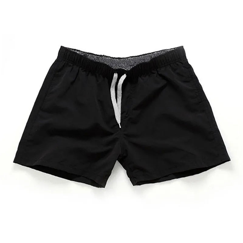 Men's straight leg polyester board shorts on a hanger, available in multiple colours and plus sizes.