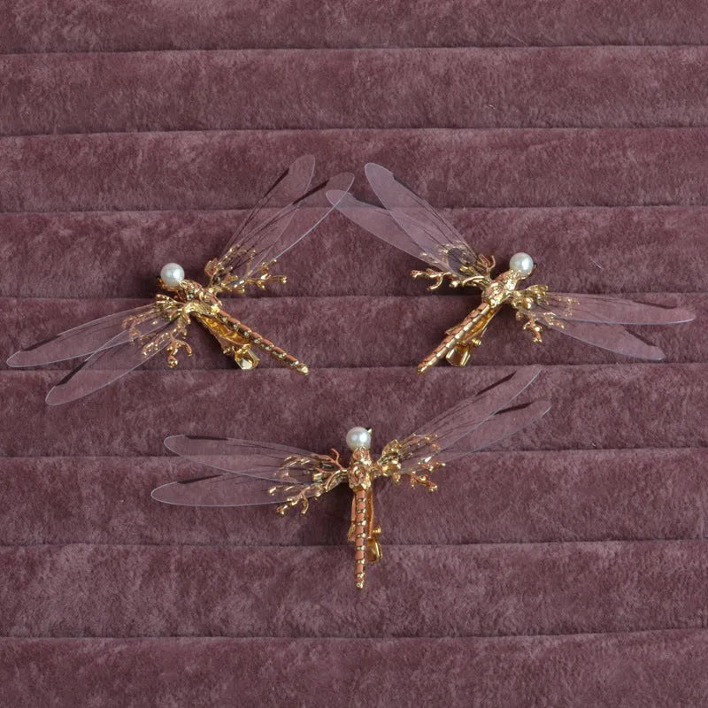 Golden dragonfly-shaped side clip headdress for women's hair, made from alloy with an electroplated finish.