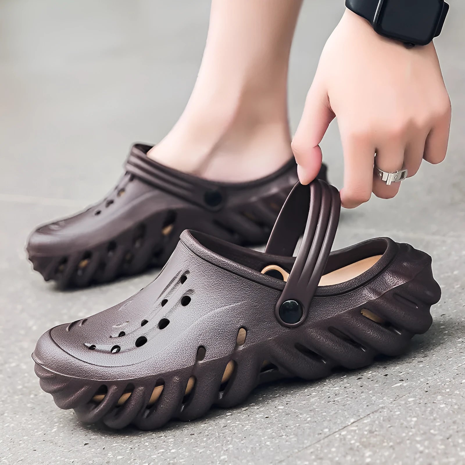 Men's beige EVA slipper sandals with hollow-out design and textured non-slip sole.