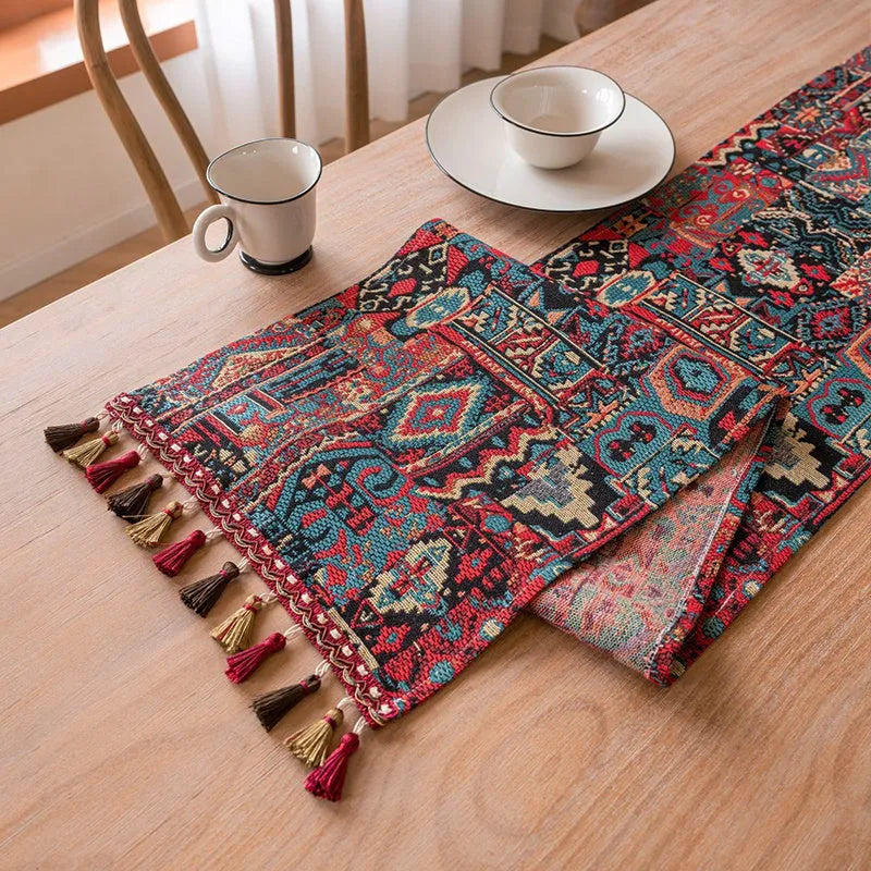 Nordic jacquard bouquet pattern table runner with decorative tassel trim in dark blue colour