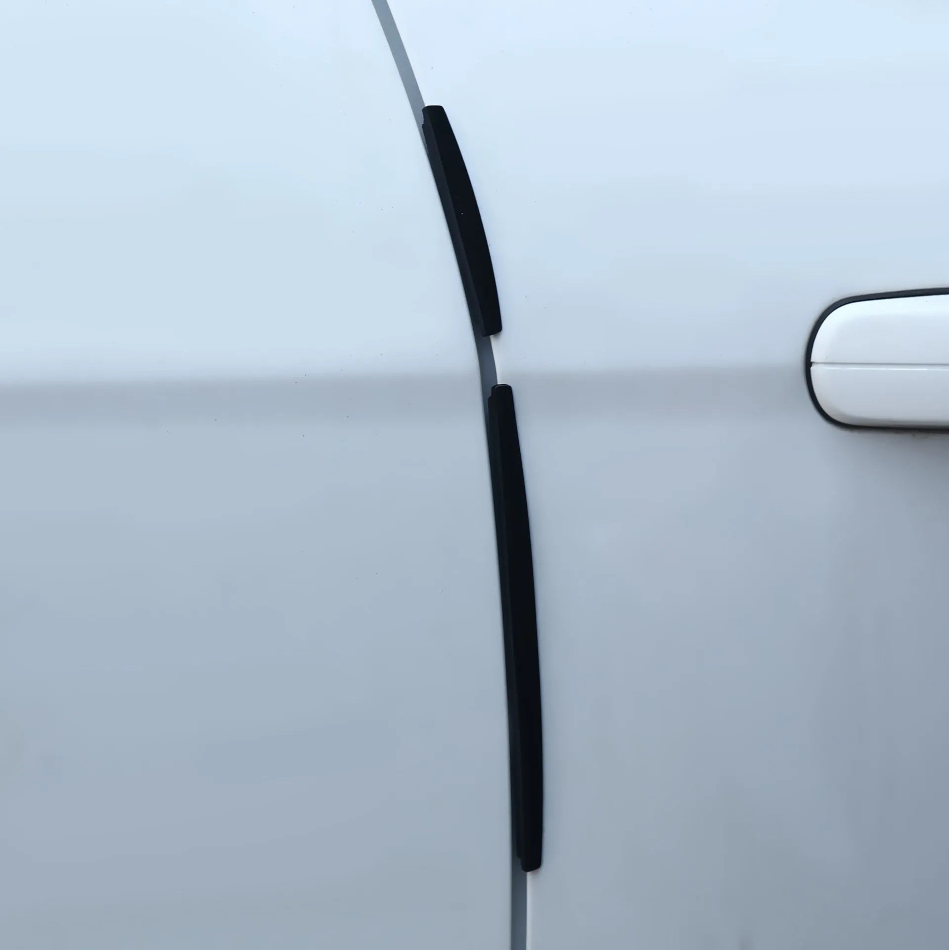 White plastic car door edge anti-collision strip protector set.
