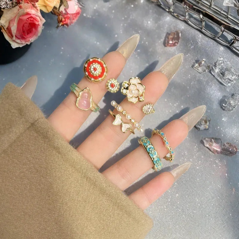 Adjustable copper ring with vintage oil dripping gourd design, zircon inlay, and floral bow shapes in New Chinese style.
