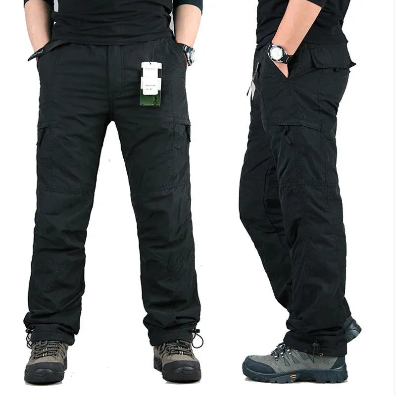 Men's stone-washed cotton overalls with a velvet lining, shown in a loose straight-leg fit.