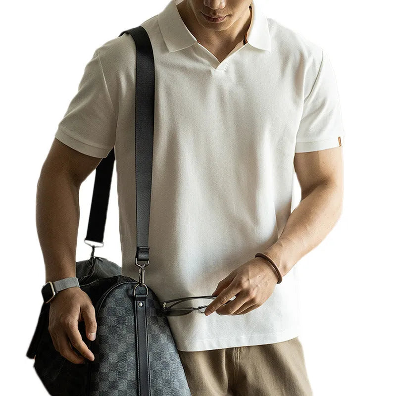 American-style short-sleeved polo shirt in blue cotton blend fabric on hanger