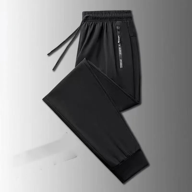 Men's loose fit thin ice silk polyester trousers in black leg style for autumn casual wear