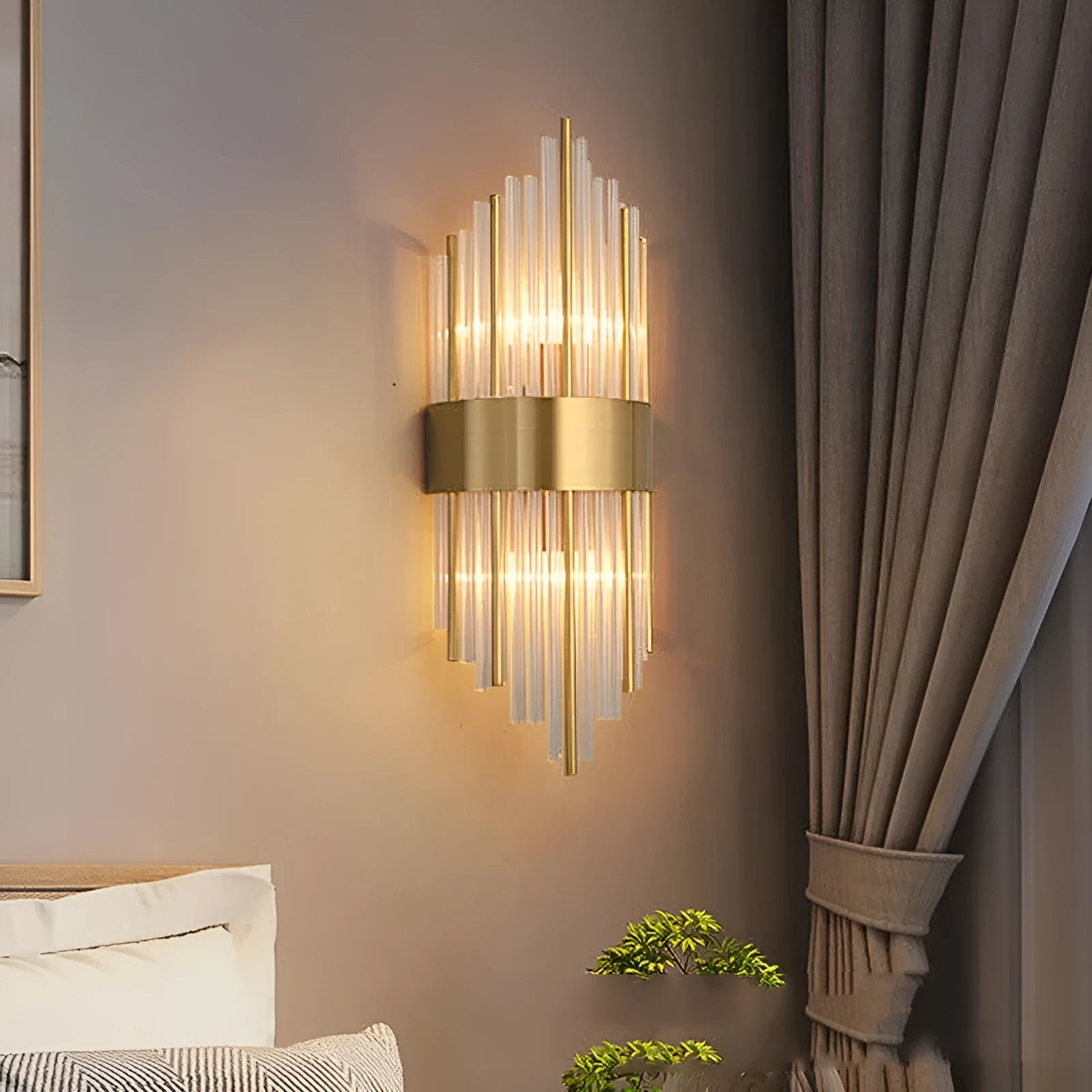Modern crystal petal-shaped wall lamp in titanium gold finish mounted on a light-coloured wall.