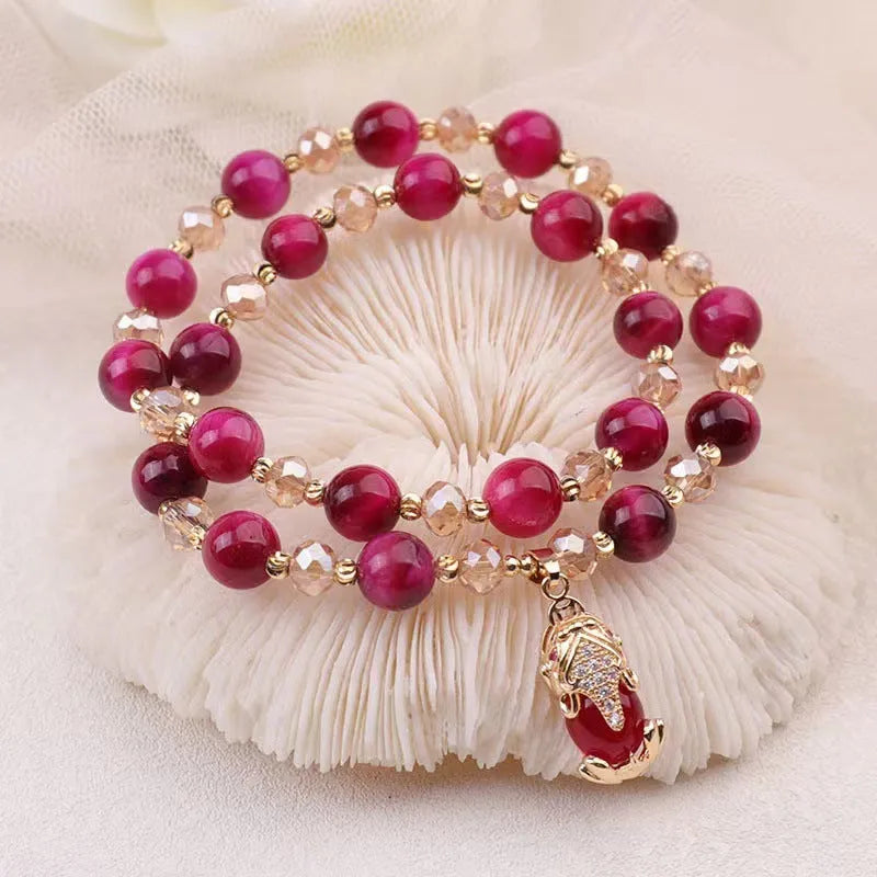 Handmade Vanves Stone Tigereye bracelet on wrist, showing single and double chain options with fox and leather charms.