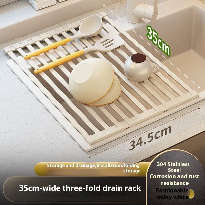 Milky white foldable stainless steel kitchen draining rack shown in a sink.