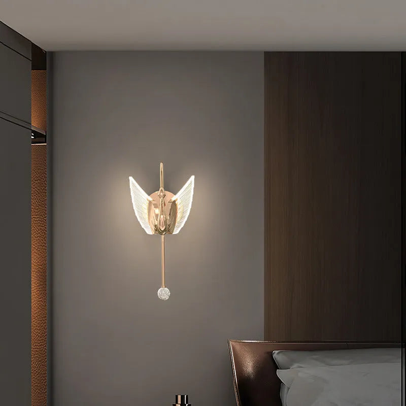 Gold swan-shaped wall lamp with acrylic shade and iron construction for bedroom lighting