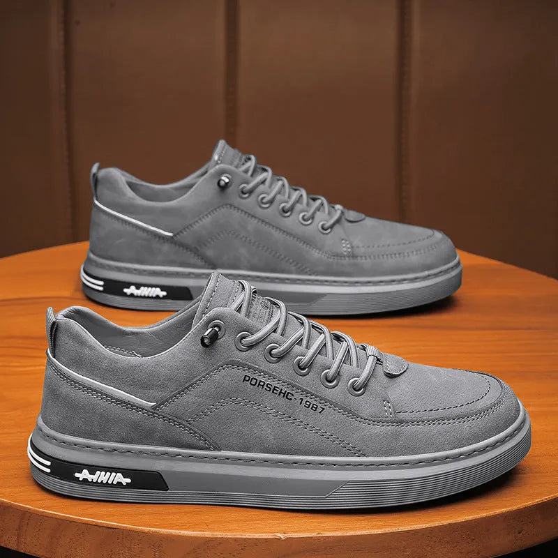 Men's black low-top casual work shoes with a rubber sole and artificial PU upper.