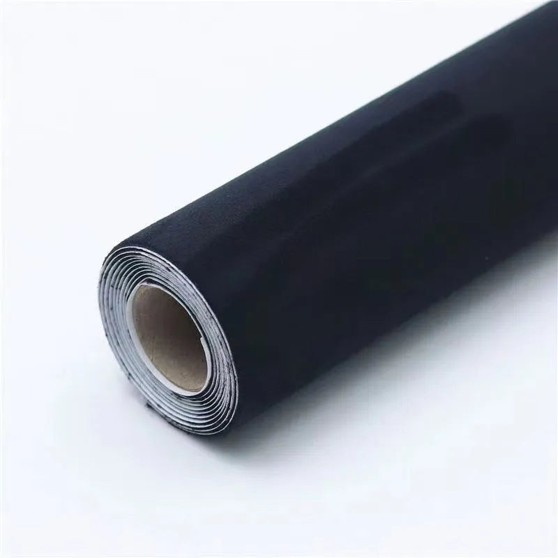 Rolls and sheets of coloured self-adhesive suede leather material for DIY projects.