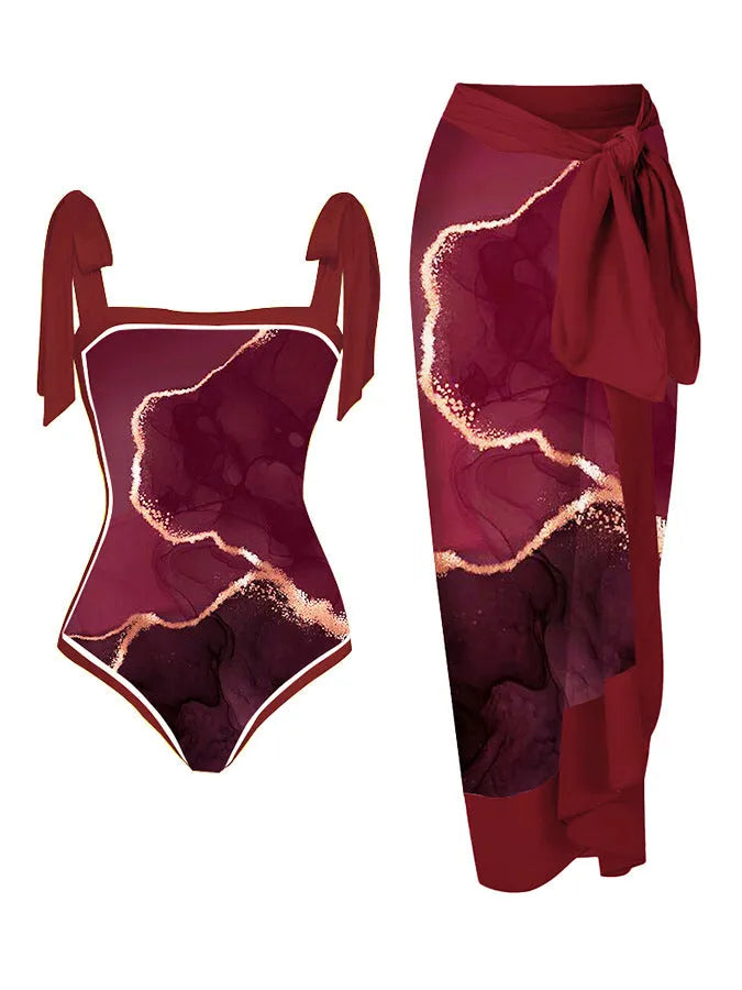 Women's floral print two-piece swimsuit with a sheer chiffon hip skirt, shown in one of the available colour variations.
