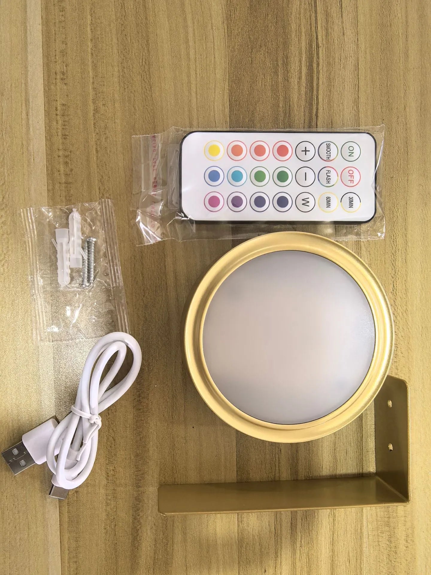 Wireless LED painting lamp with a magnetic mounting belt and remote control in black finish.