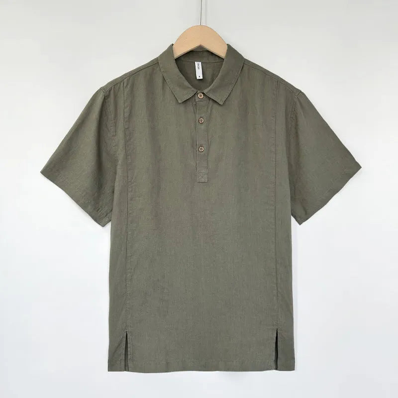 Men's loose fit linen summer top with short sleeves and thin lapels on a hanger.