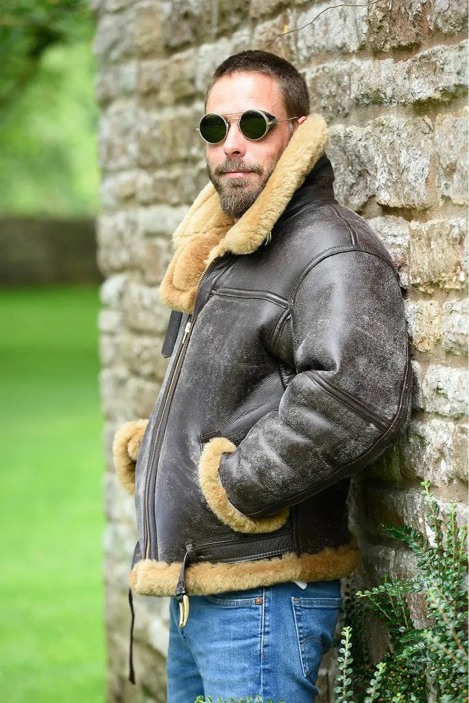 Brown retro-style men's synthetic leather fur coat with side pockets and a straight hem.