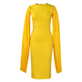 Yellow long sleeve evening gown with a high waist and pleated shawl collar on a mannequin.