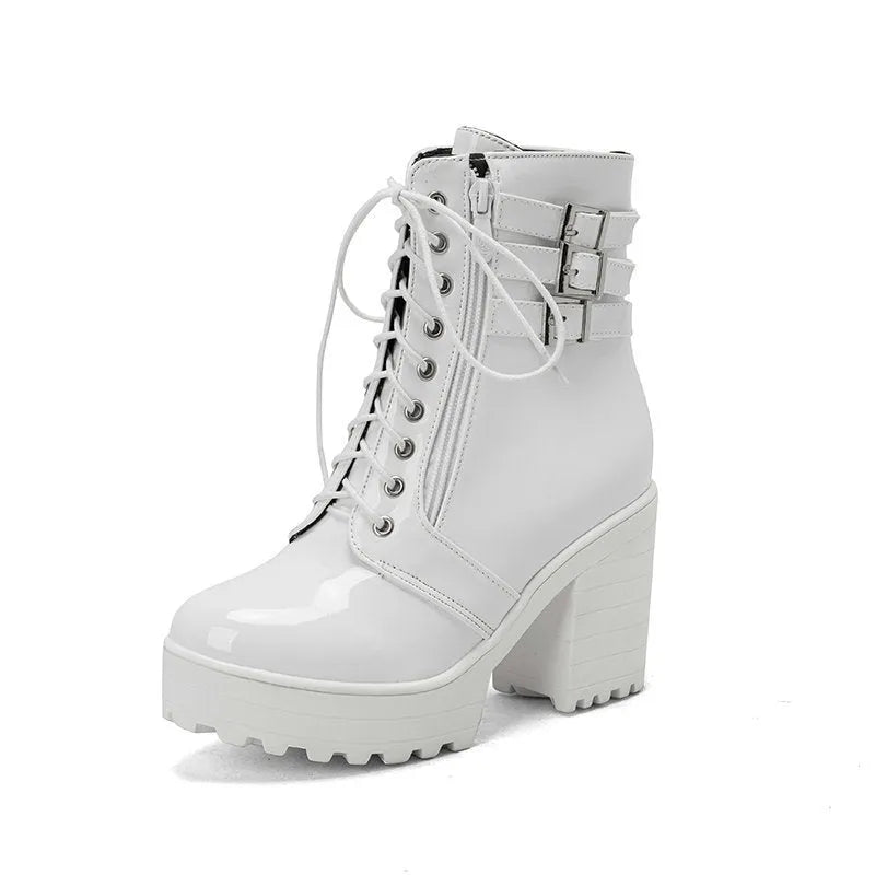 Women's black thick-heeled short boots with lace-up front and round toe on a waterproof platform.