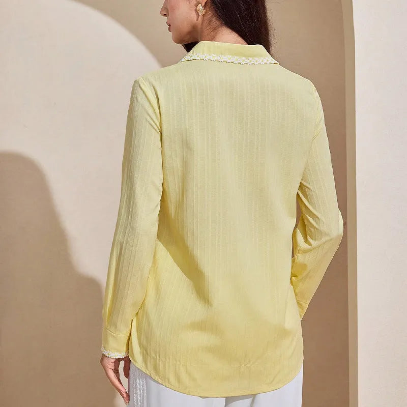 Yellow solid colour lace long-sleeved cardigan top with stitching details on a plain background
