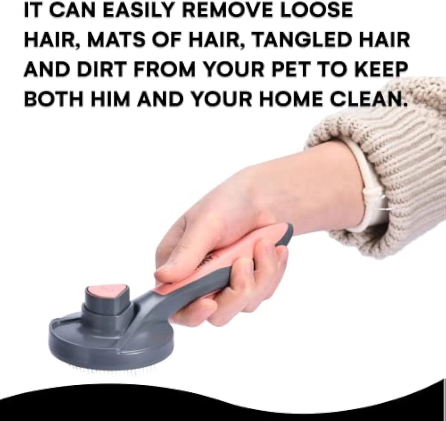 Grey self-cleaning slicker brush for grooming cats and dogs on a wooden table.