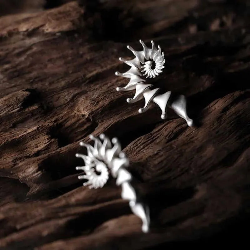 Conch colour stud earrings with three-dimensional matte finish and irregular contemporary design