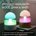 White cloud-shaped ultrasonic humidifier and aroma diffuser with colourful lighting and simulated raindrops