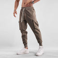 Men's cotton sports trousers with ankle ties and multiple pockets in apricot colour