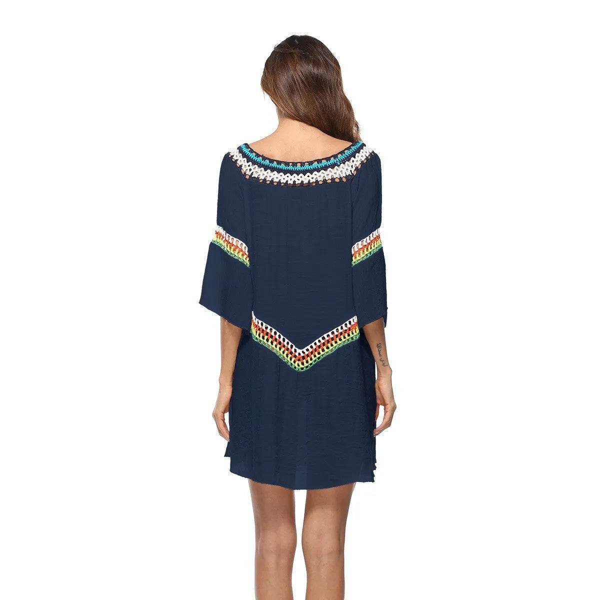 Women's crocheted ethnic style sun protection clothing in apricot colour with beach background
