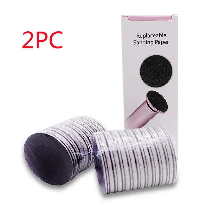 Electric foot callus remover with sandpaper disc attached for removing dead skin and calluses from heels