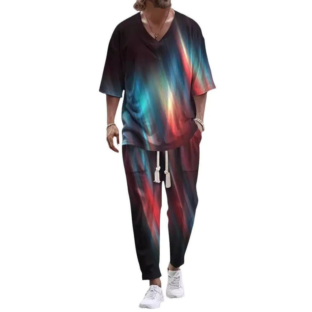 Thin polyester fibre co-ordinated suit with V-neck top, cropped sleeves, and matching trousers on a hanger.
