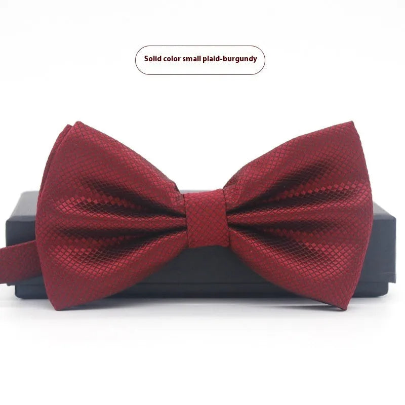 Solid colour flat head bow tie for formal wear in multiple colours including black, red, and blue.