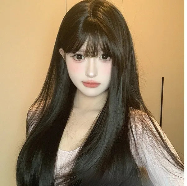 Dark brown long straight synthetic wig with bangs on wig head, showing full-head coverage
