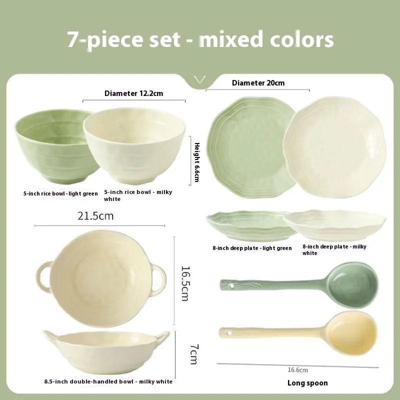 Seven-piece solid colour ceramic tableware set with modern Japanese style design on a table.