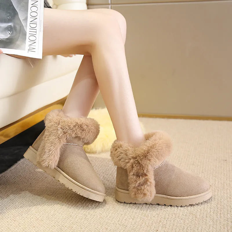 Women's winter snow boots in beige with fluffy platform, round toe, and artificial wool lining on a white background