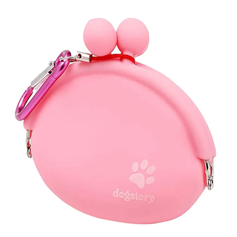 Yellow silicone dog treat pouch with hook and loop strap, shown on a waistband.