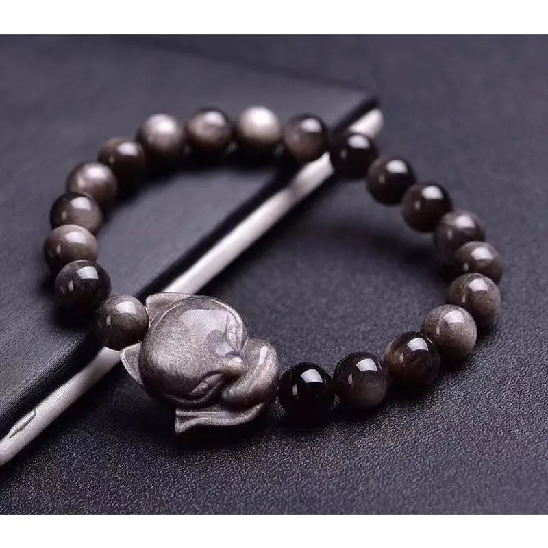 Obsidian fox charm bracelet on an adjustable leather cord for women.
