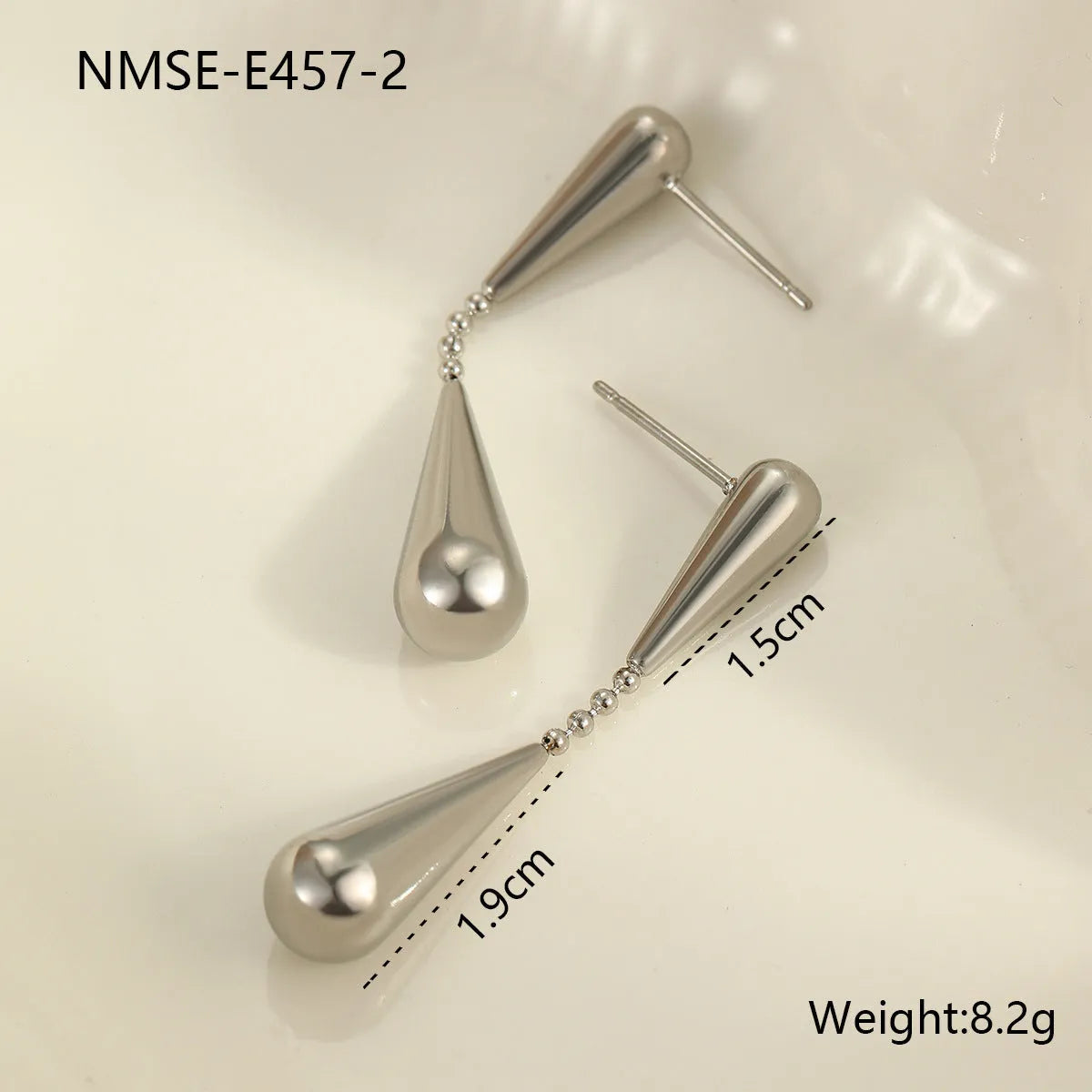 Stainless steel tassel water drop earrings with Y-word chain ornament in 18K gold electroplated finish, geometric drop-shaped design