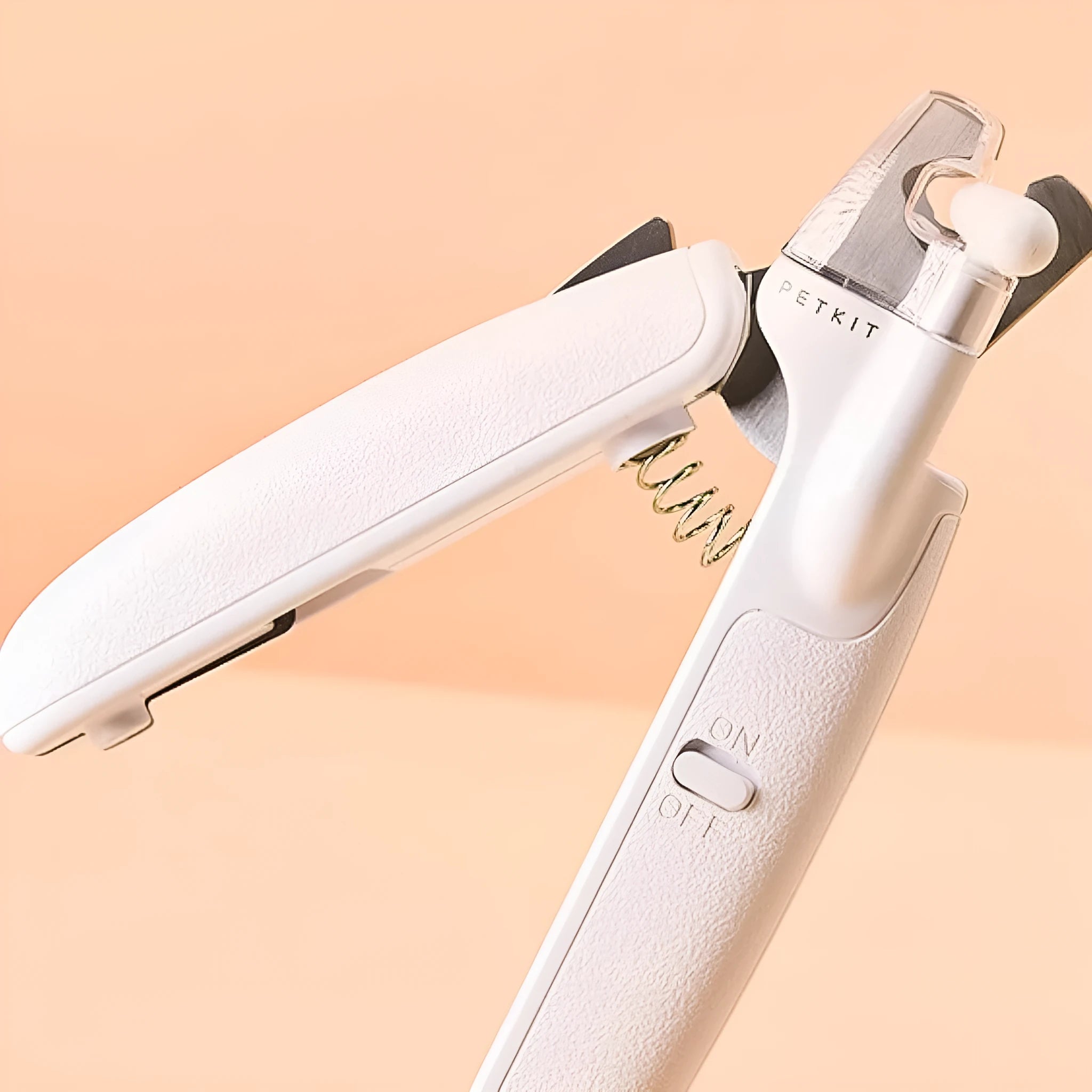 White pet nail clippers with LED light and transparent anti-splash guard for cats and dogs