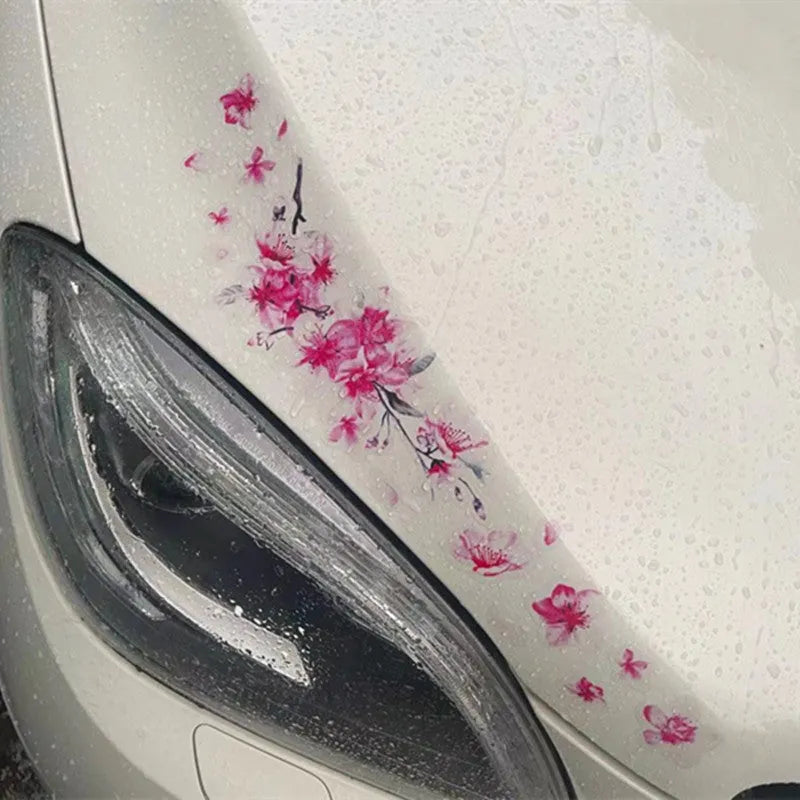 PVC cherry blossom car sticker shown in two size options on a vehicle window.