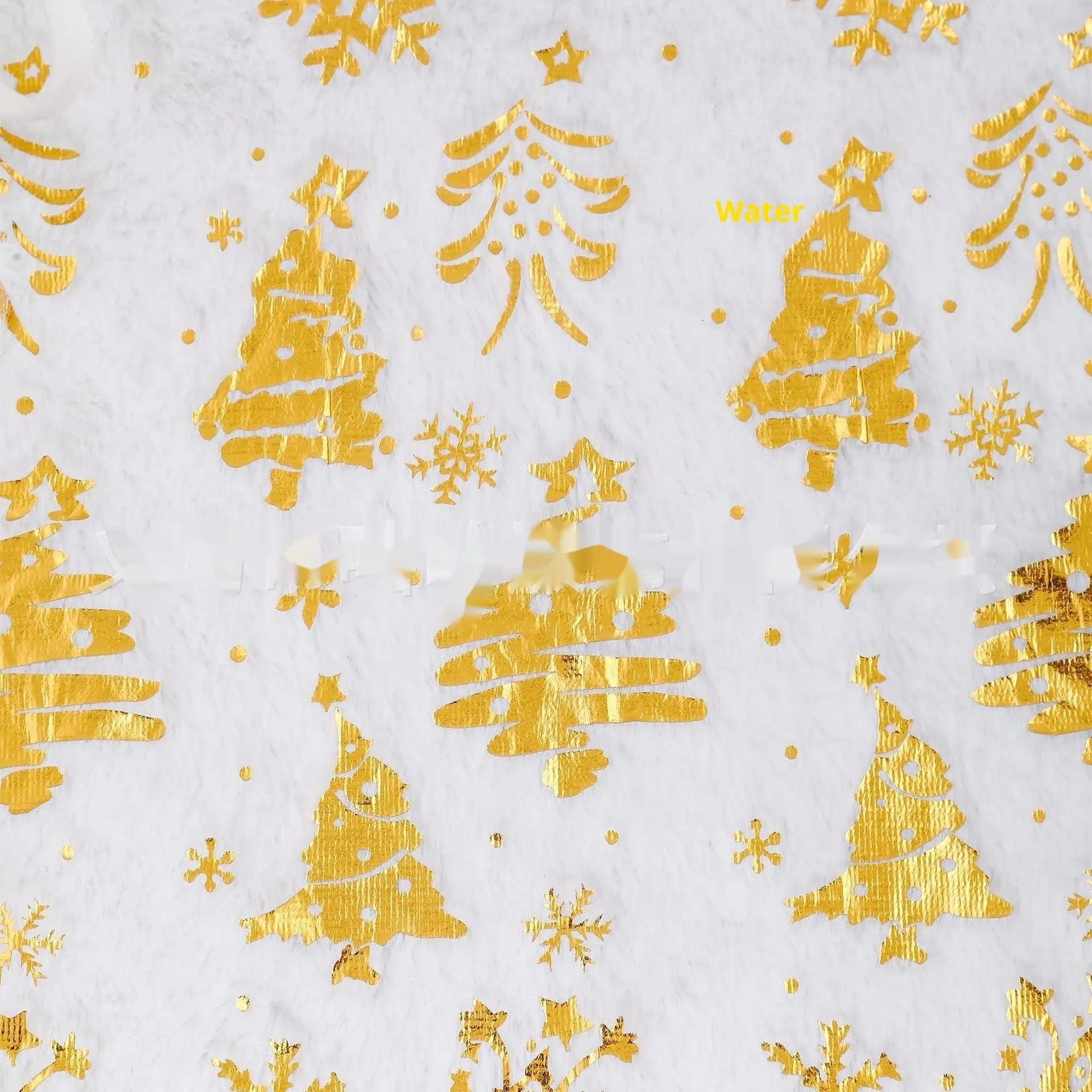 Plush red and green Christmas tree floor mat with snowflake design on a wooden floor.