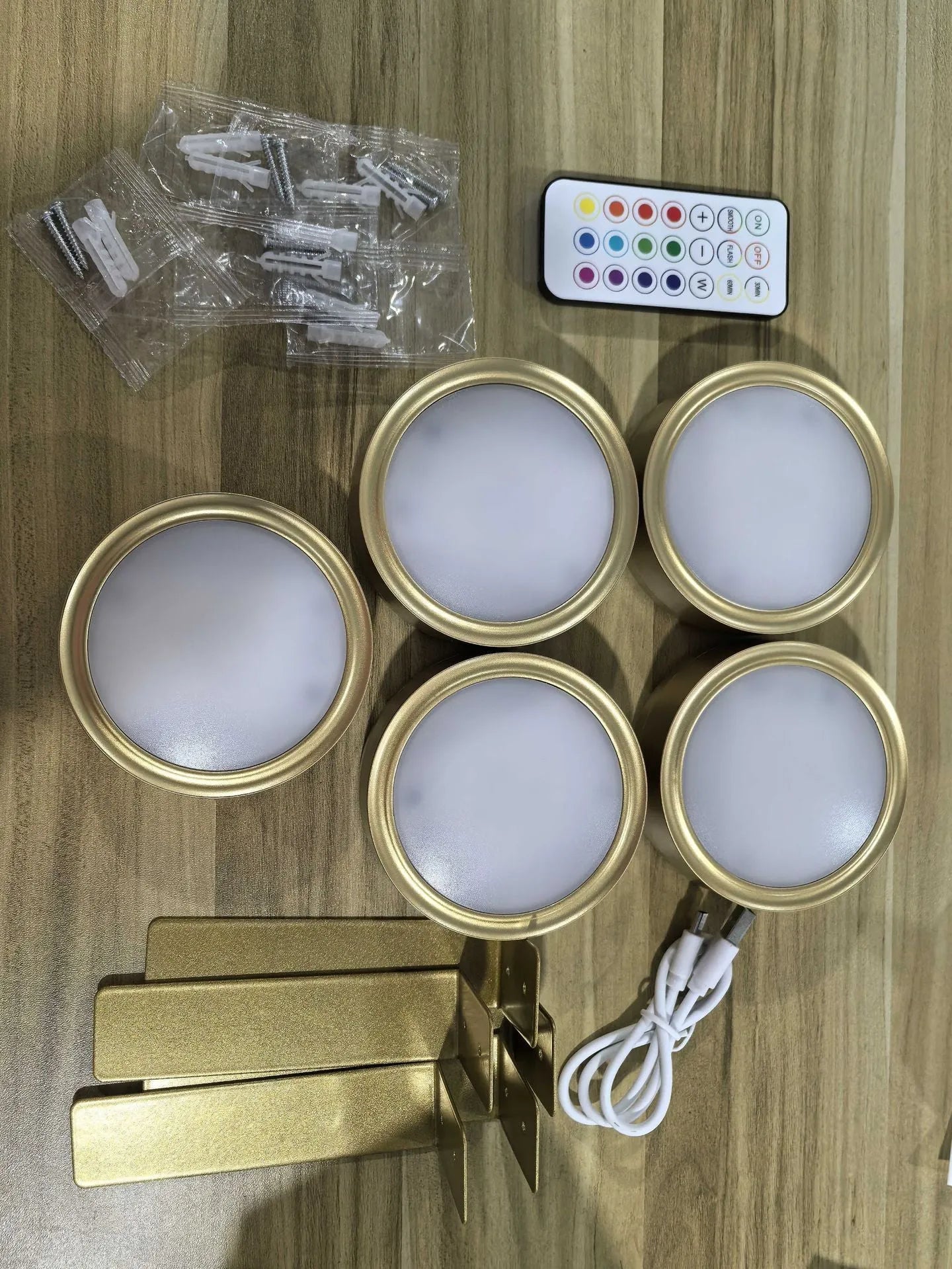 Wireless LED painting lamp with a magnetic mounting belt and remote control in black finish.