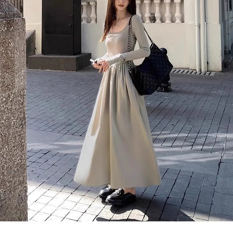Women's black knitted dress with square collar, long sleeves, elastic waist, and A-line floor-length skirt