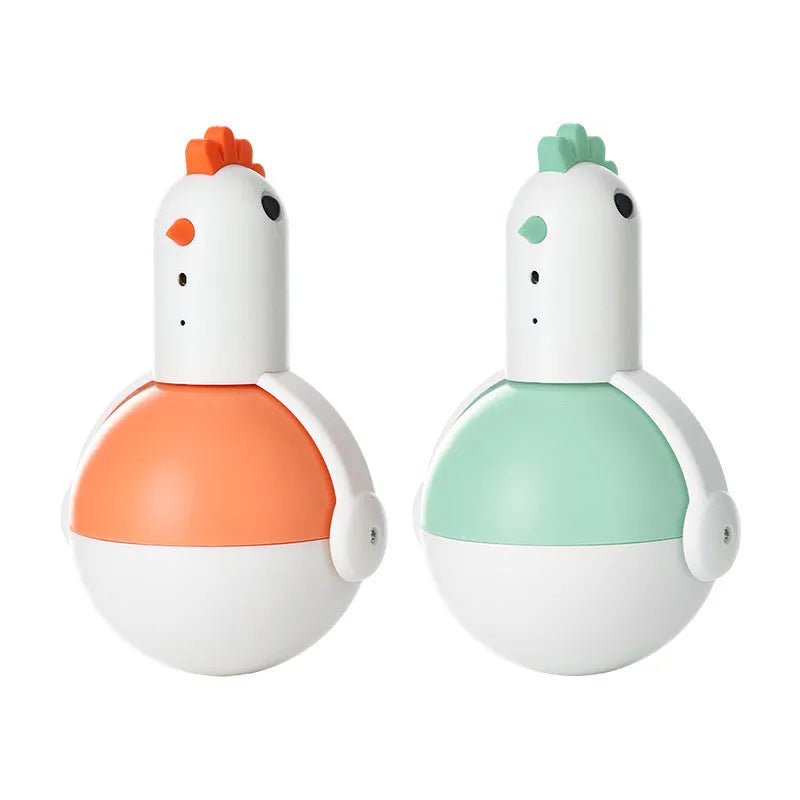 Green and orange electric cat toy chicken with laser light and sound features on a floor