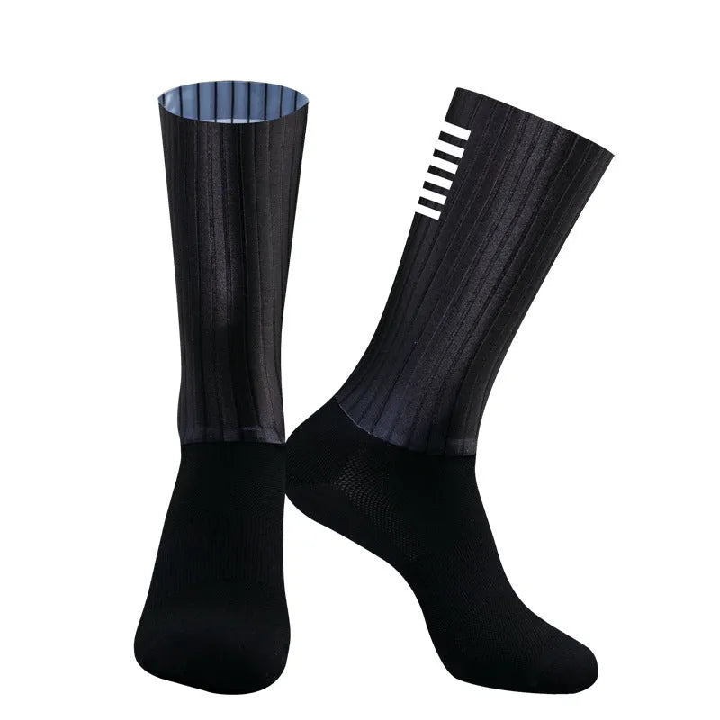 Cycling socks in chemical fibre blend fabric shown in orange, black, purple, white, grey and dark blue colour options