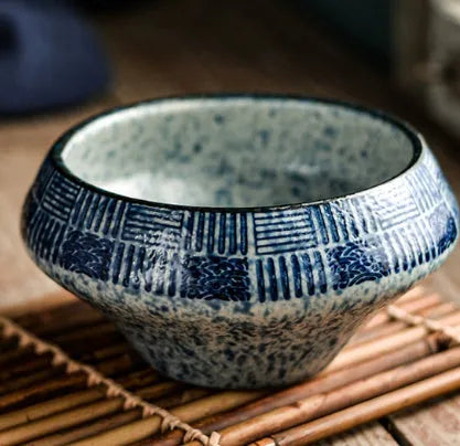 Ceramic Japanese soup bowl with stone conch shape and traditional Edo pattern design