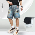 Men's blue ripped denim shorts with graffiti design and straight leg.
