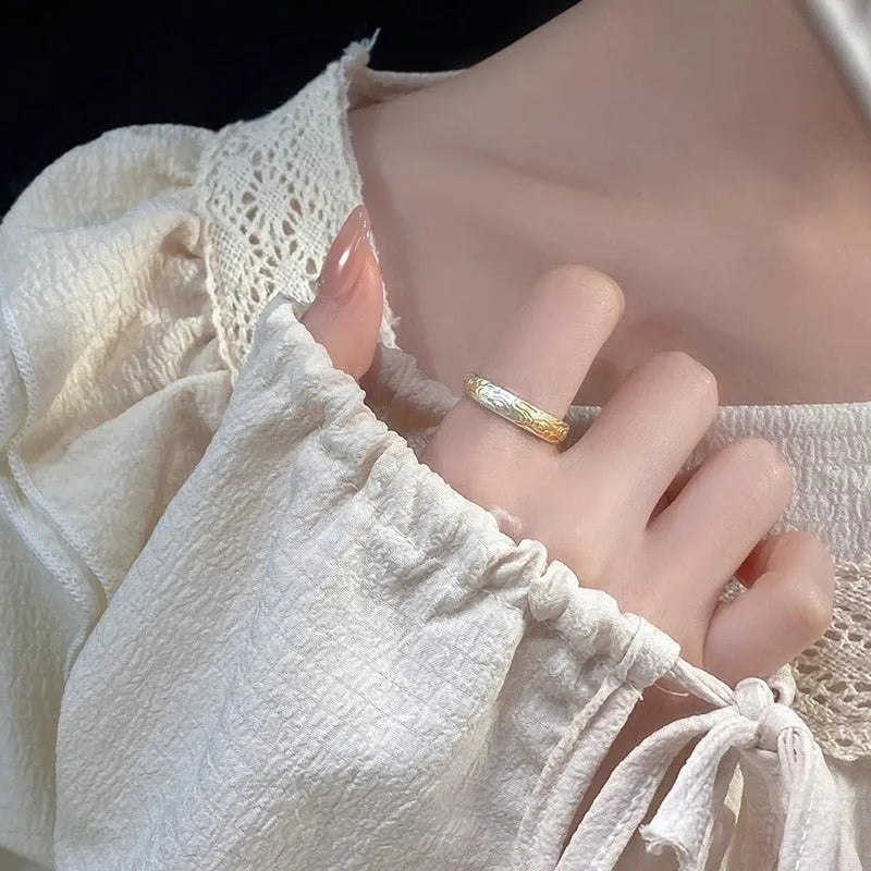 Geometric open mouth ring with Xiangyun pattern in electroplated silver and gold finish on white copper